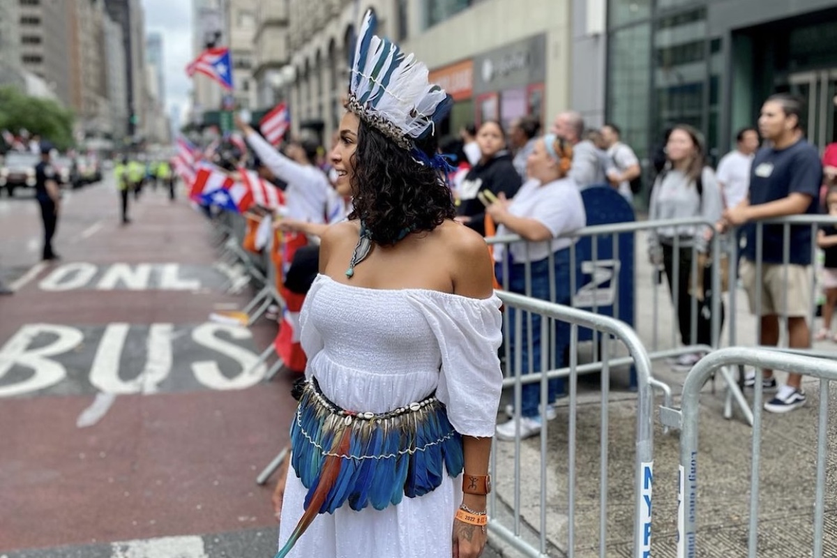 Princess Nokia at the Puerto Rican parade in NYC, in a traditional Puerto Rican headdress and belt.